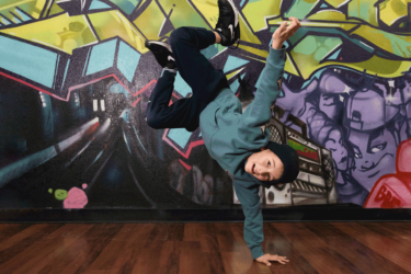 Boy breakdancing in studio